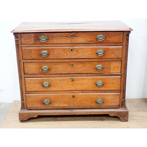 475 - A 19th Century elm Chest of four long drawers with quarter round pilasters and raised on bracket sup... 