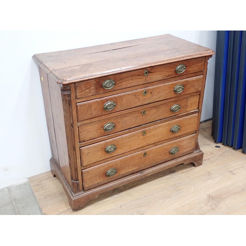 475 - A 19th Century elm Chest of four long drawers with quarter round pilasters and raised on bracket sup... 