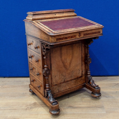 482 - A Victorian walnut Davenport Desk with hinged top enclosing letter rack, the sloping front enclosing... 