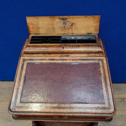 482 - A Victorian walnut Davenport Desk with hinged top enclosing letter rack, the sloping front enclosing... 