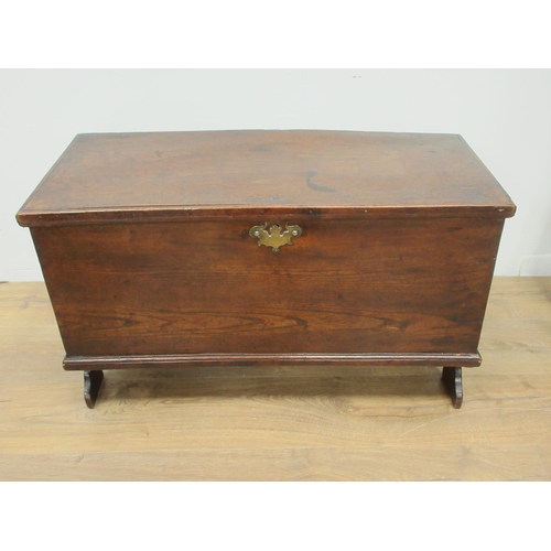 484 - A small 18th Century elm Blanket Chest with hinged cover enclosing a candle box, and raised on shape... 