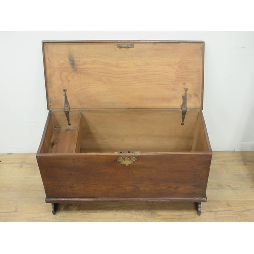 484 - A small 18th Century elm Blanket Chest with hinged cover enclosing a candle box, and raised on shape... 