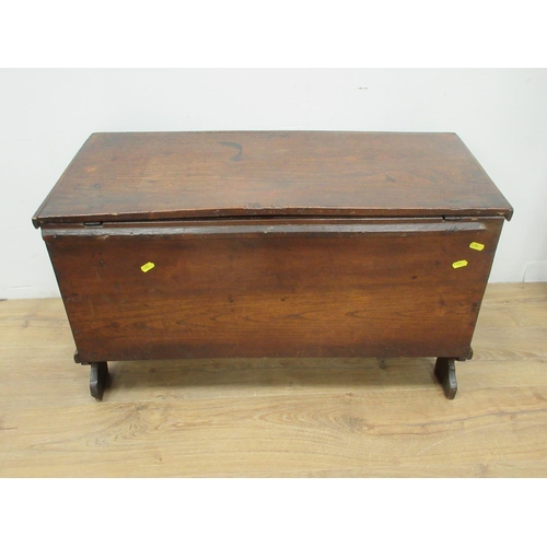 484 - A small 18th Century elm Blanket Chest with hinged cover enclosing a candle box, and raised on shape... 