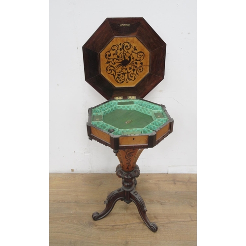 498 - A Victorian Sewing Table with marquetry inlay having octagonal hinged top enclosing fitted compartme... 