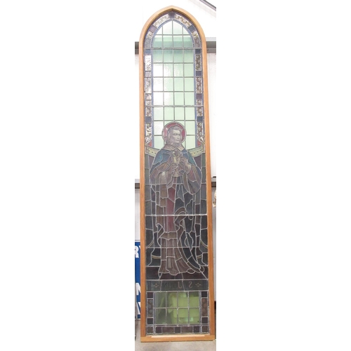 499 - A late 19th Century coloured leaded glass church Window depicting St John in modern oak frame 11ft 6... 