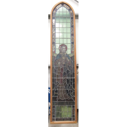 499 - A late 19th Century coloured leaded glass church Window depicting St John in modern oak frame 11ft 6... 