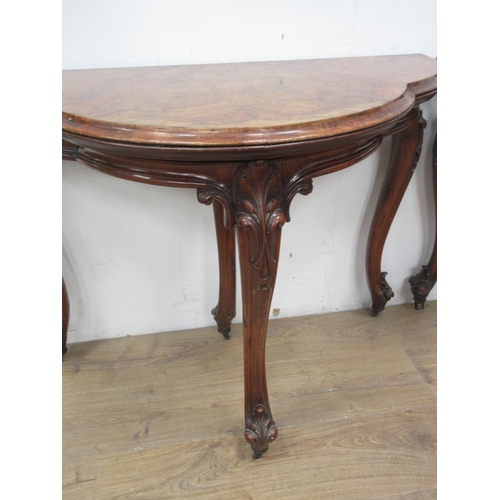 501 - A pair of Victorian walnut fold-over Card Tables of trefoil shape with green and red baize interior ... 