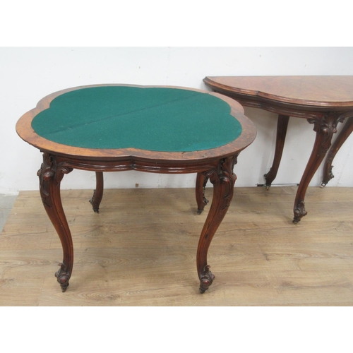 501 - A pair of Victorian walnut fold-over Card Tables of trefoil shape with green and red baize interior ... 