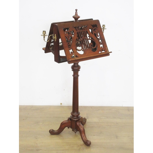 502 - A 19th Century walnut double-sided adjustable Music Stand with pierced fret carving in the form of a... 