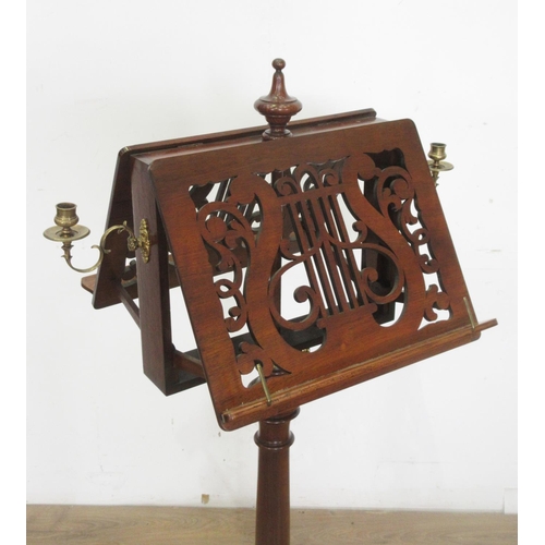 502 - A 19th Century walnut double-sided adjustable Music Stand with pierced fret carving in the form of a... 