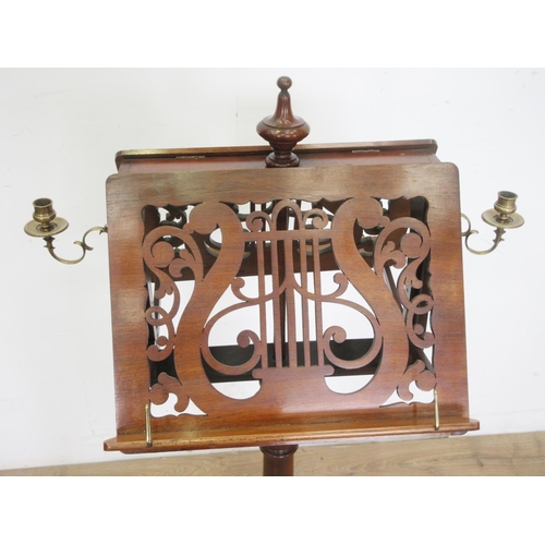 502 - A 19th Century walnut double-sided adjustable Music Stand with pierced fret carving in the form of a... 