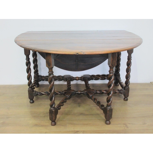 503 - An oak Gateleg Table in the Georgian style with moulded oval top, the leaves supported on double gat... 