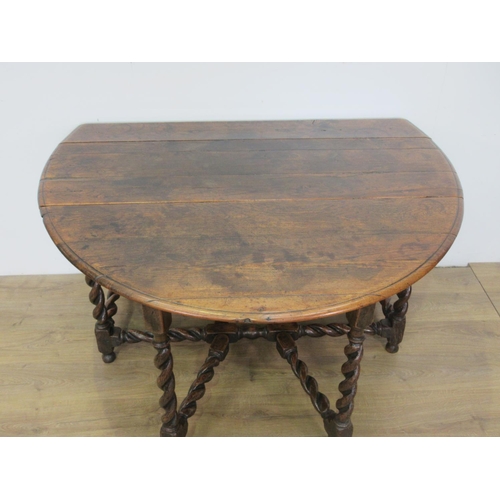 503 - An oak Gateleg Table in the Georgian style with moulded oval top, the leaves supported on double gat... 