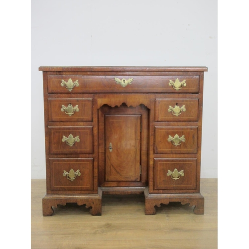 507 - An 18th Century walnut kneehole Dressing Table, the crossbanded quartered top above a long drawer an... 