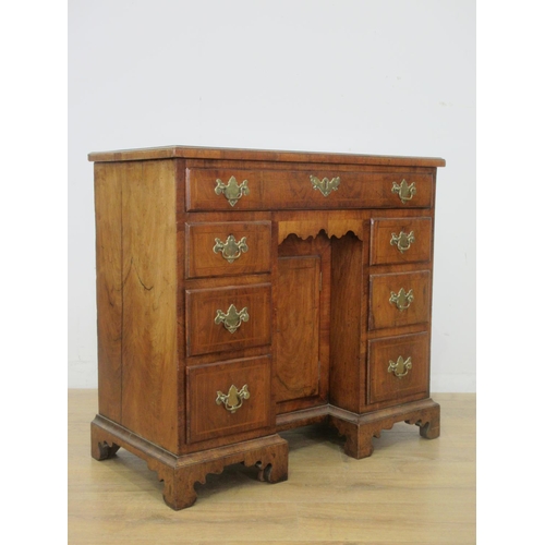 507 - An 18th Century walnut kneehole Dressing Table, the crossbanded quartered top above a long drawer an... 