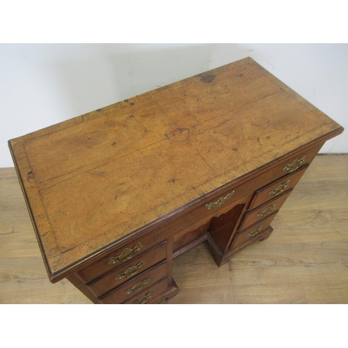 507 - An 18th Century walnut kneehole Dressing Table, the crossbanded quartered top above a long drawer an... 