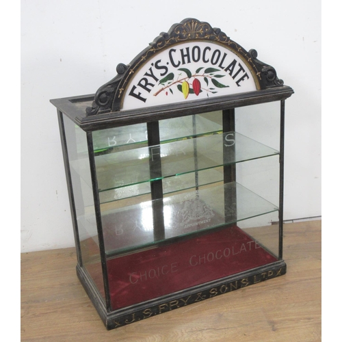 508 - A late 19th or early 20th Century Fry's Chocolate glazed Display Cabinet with arched surmount decora... 