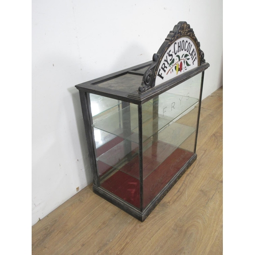 508 - A late 19th or early 20th Century Fry's Chocolate glazed Display Cabinet with arched surmount decora... 