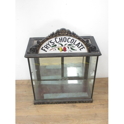 508 - A late 19th or early 20th Century Fry's Chocolate glazed Display Cabinet with arched surmount decora... 