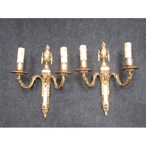 510 - A pair of Louis XVI style brass two branch Wall Sconces with urn finials and ram's head masks, 14in ... 