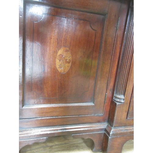 519 - A Georgian mahogany Dresser and Rack with shaped frieze flanked by cupboard doors, the base fitted a... 