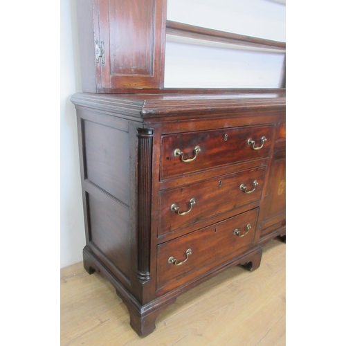 519 - A Georgian mahogany Dresser and Rack with shaped frieze flanked by cupboard doors, the base fitted a... 