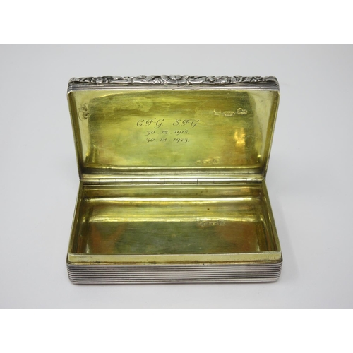 52 - A George IV silver Snuff Box by William Simpson, the top with embossed scene depicting a covey of ga... 