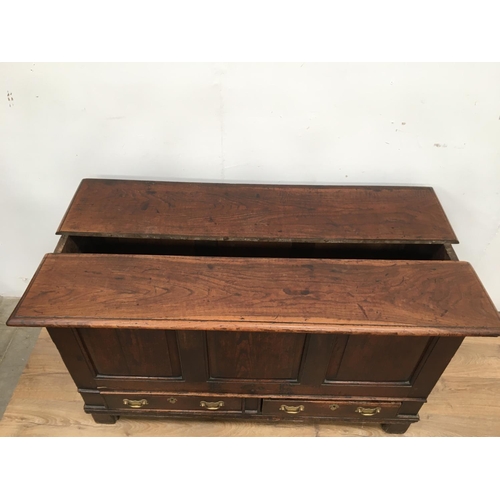 521 - An 18th Century oak Mule Chest with fielded panelled front above two drawers, 4ft 6in W, bearing the... 