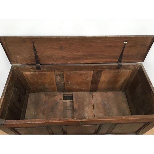 521 - An 18th Century oak Mule Chest with fielded panelled front above two drawers, 4ft 6in W, bearing the... 