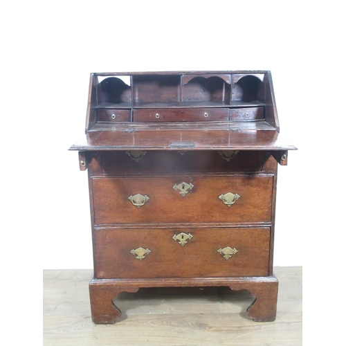 522 - An 18th Century oak Bureau of small proportions with fitted interior above three drawers on bracket ... 