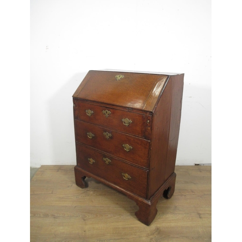 522 - An 18th Century oak Bureau of small proportions with fitted interior above three drawers on bracket ... 