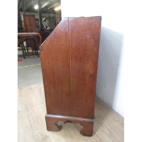 522 - An 18th Century oak Bureau of small proportions with fitted interior above three drawers on bracket ... 