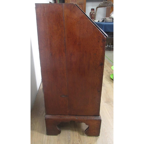 522 - An 18th Century oak Bureau of small proportions with fitted interior above three drawers on bracket ... 