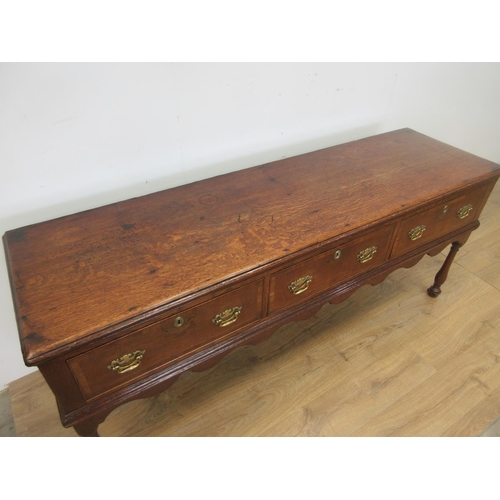 526 - An 18th Century oak Dresser Base with moulded top, three frieze drawers above a shaped frieze on bal... 