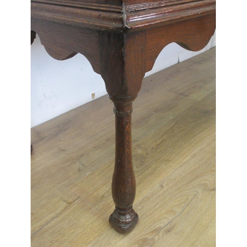 526 - An 18th Century oak Dresser Base with moulded top, three frieze drawers above a shaped frieze on bal... 