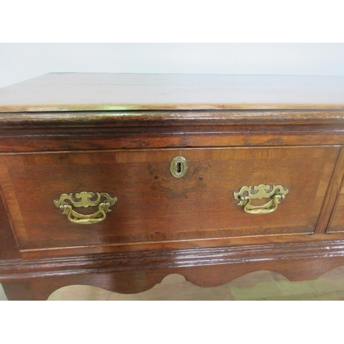 526 - An 18th Century oak Dresser Base with moulded top, three frieze drawers above a shaped frieze on bal... 