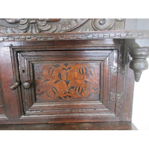 528 - A primarily 17th Century oak Deuddarn with carved frieze dated 1563 with serpent decoration above a ... 