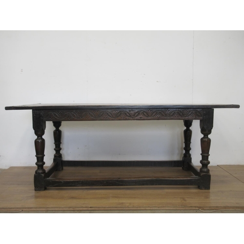 529 - A 17th Century oak Refectory Table with three plank cleated top above interlocking lunette and chann... 