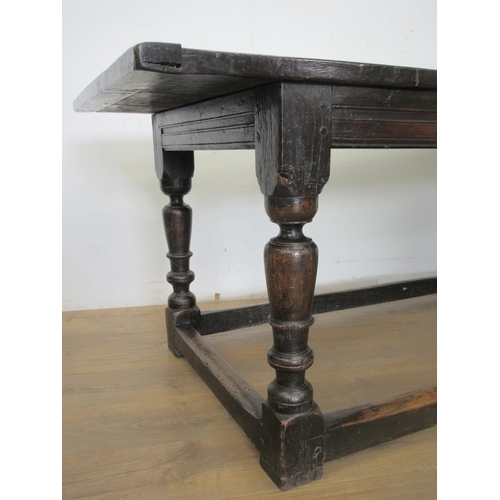 529 - A 17th Century oak Refectory Table with three plank cleated top above interlocking lunette and chann... 