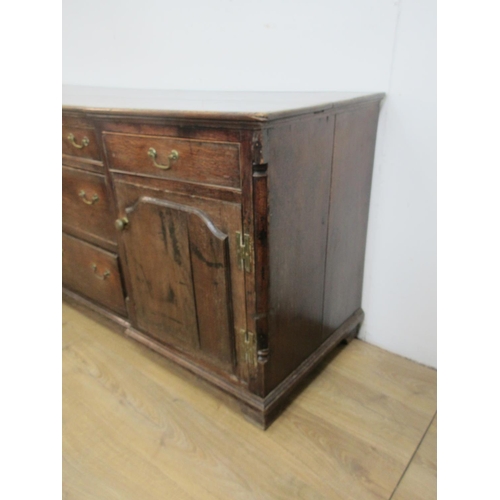 534 - An 18th Century oak inverted breakfront Dresser Base fitted five drawers and pair of raised panelled... 