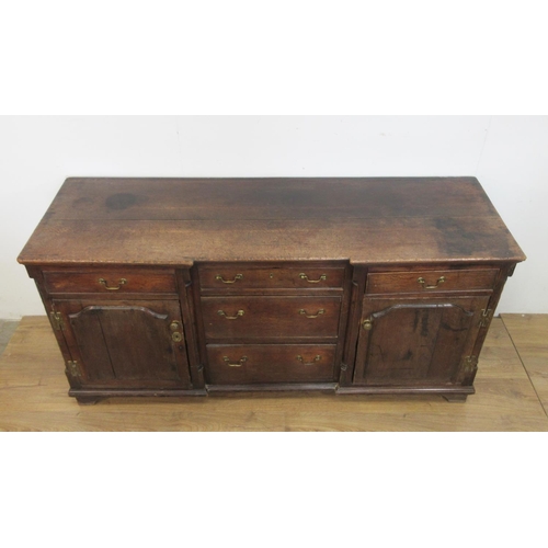 534 - An 18th Century oak inverted breakfront Dresser Base fitted five drawers and pair of raised panelled... 