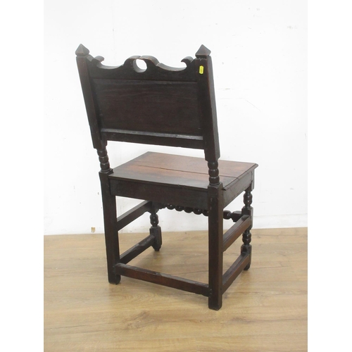 542 - A 17th Century oak Side Chair with shaped top rail, leafage scroll carved panelled back, solid seat ... 