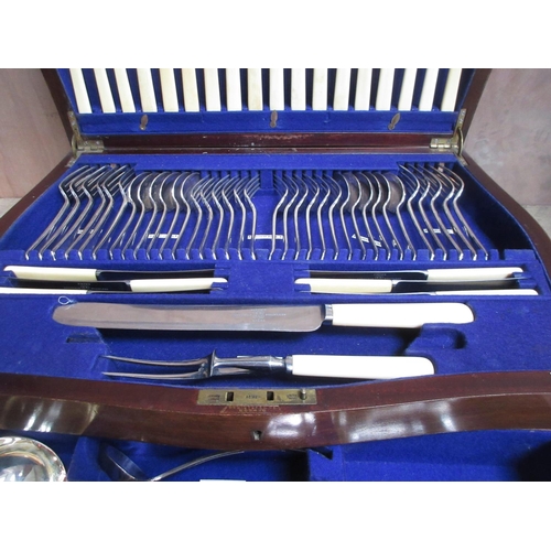 60 - A Canteen of Cutlery for twelve with dog nose finials, includes Table and Dessert Forks and Knives, ... 