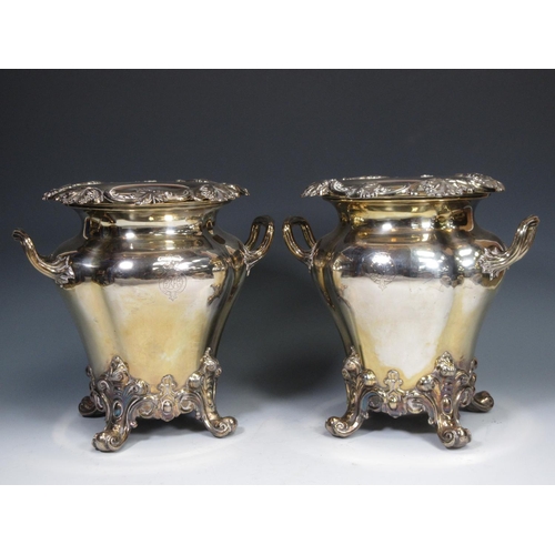 63 - A pair of plated Wine Coolers having moulded fruiting vine borders, two scroll handles on four scrol... 