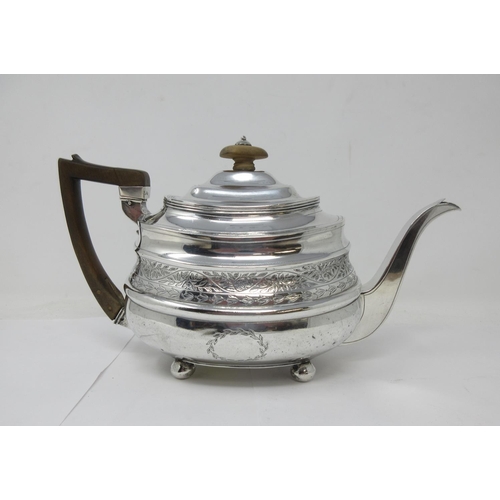 9 - A George III silver boat shape Teapot with leafage engraved frieze and vacant cartouche on ball feet... 