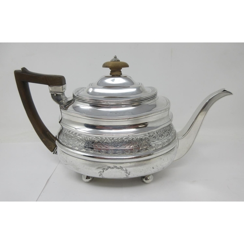 9 - A George III silver boat shape Teapot with leafage engraved frieze and vacant cartouche on ball feet... 