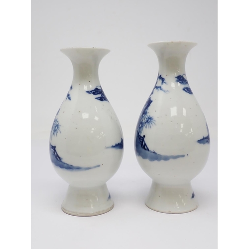 319 - A pair of 19th Century Chinese blue and white Vases of baluster form, decorated figures in a landsca... 