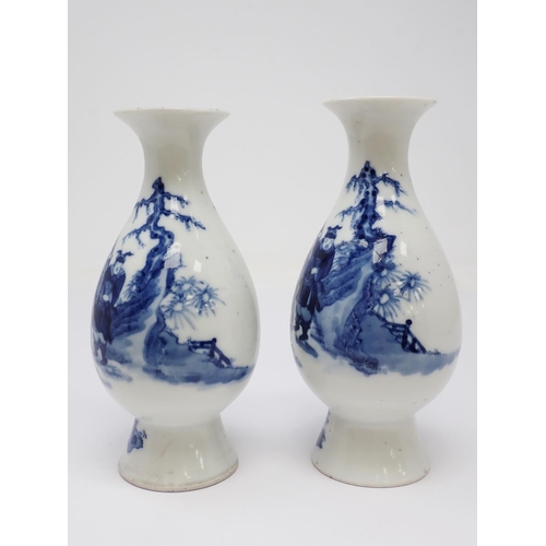 319 - A pair of 19th Century Chinese blue and white Vases of baluster form, decorated figures in a landsca... 