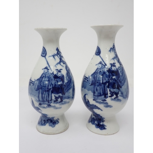 319 - A pair of 19th Century Chinese blue and white Vases of baluster form, decorated figures in a landsca... 