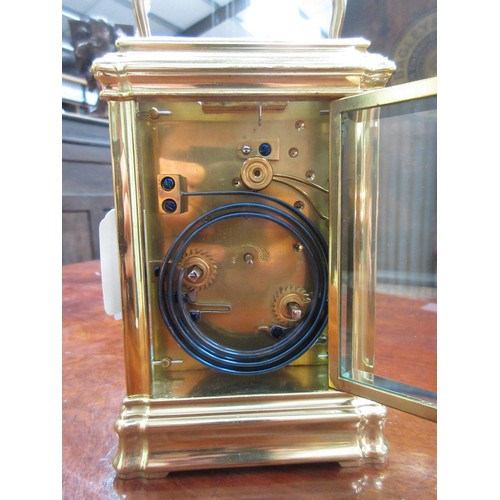 383 - A brass cased Grand Sonnerie Carriage Clock inscribed No.985 to underside within fitted leather case... 